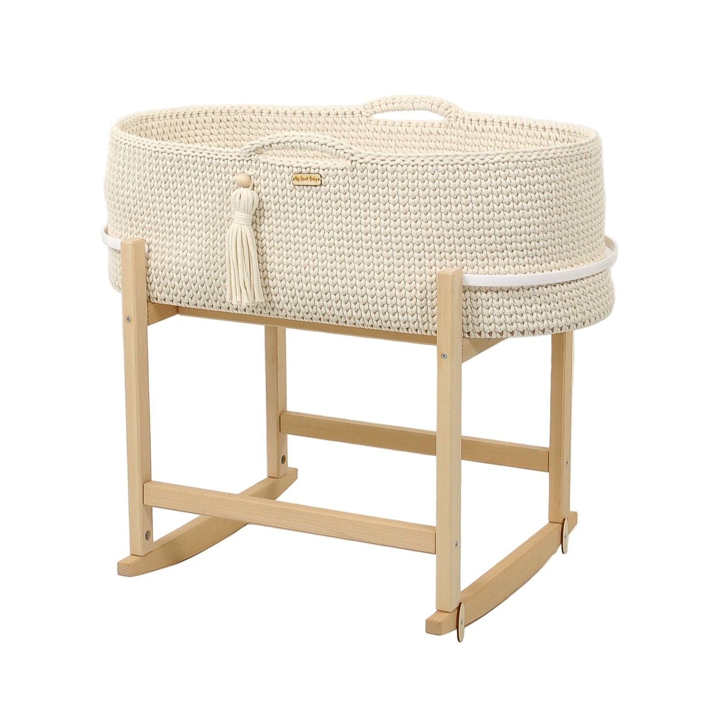 White woven baby crib with natural wood stand on a light gray background