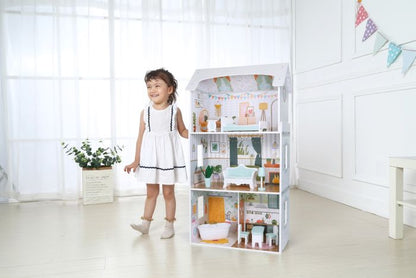 Child playing with Wooden Dollhouse Luna with LED lights, arranging furniture